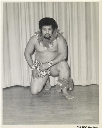 (PRO WRESTLING) Archive with 100 photographs of vibrant and scantily clad wrestlers striking a pose.